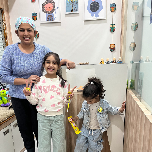 A child brought along her younger sister for dental examination after she comfortably finished her treatment with Dr Anushree Khatri